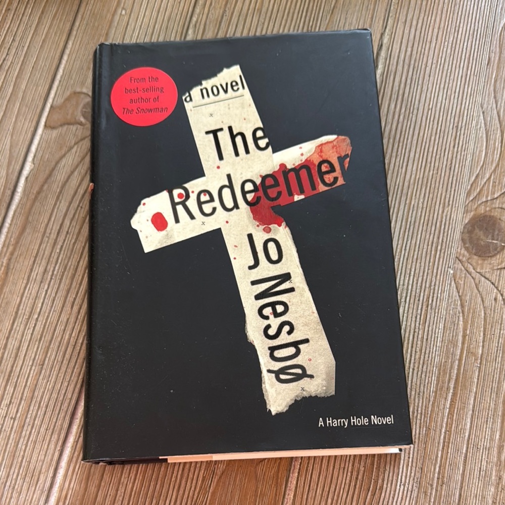 'The Redeemer' Hardcover Book - Black Cover